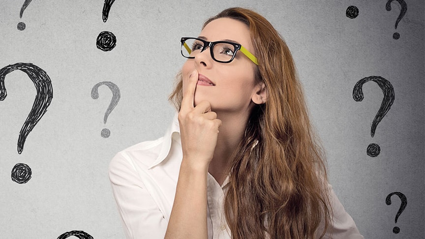 Woman with question marks behind her