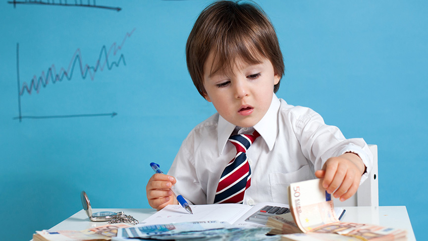 Boy in suit doing office work