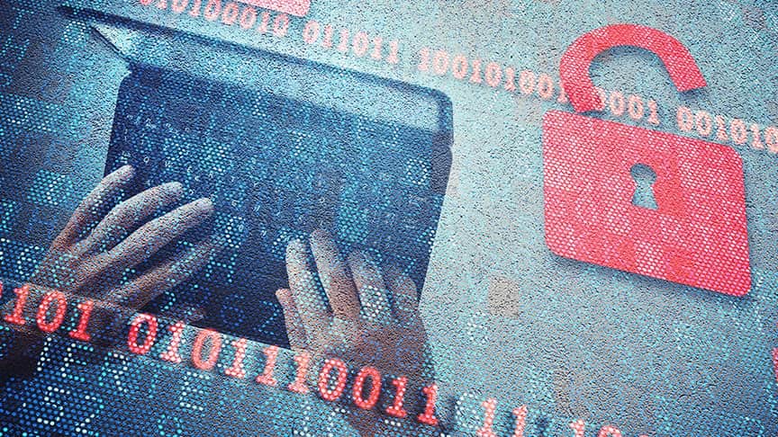 Hand on a laptop with padlock beside it