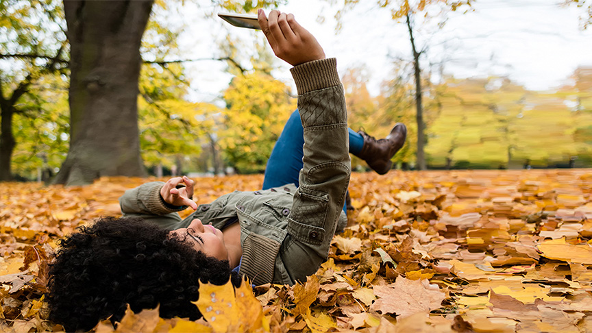 Woman lying down in leaves