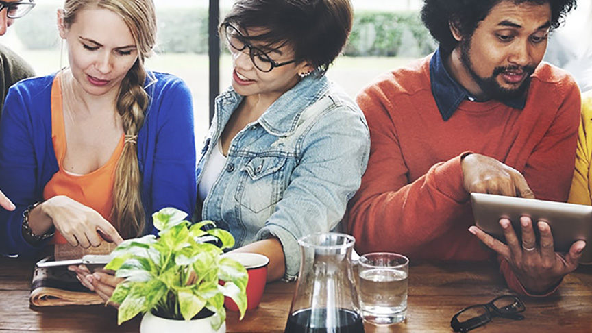 People in cafe using smart devices