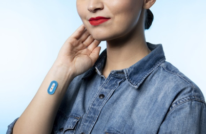 Woman with patch on wrist